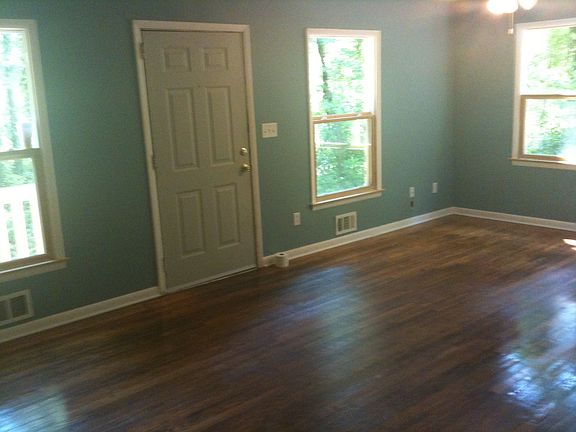 big living room, deck on other side of front door