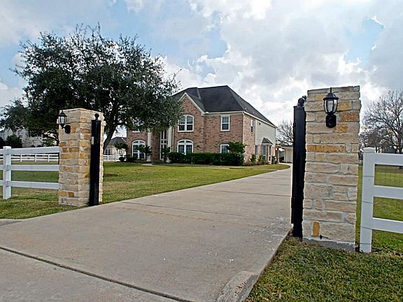 The gated entrance makes a Grand statement with decorative stone columns and a lovely light fixture. In addition, there is remote control access with a handy pin pad outside for family and friends to access as well
