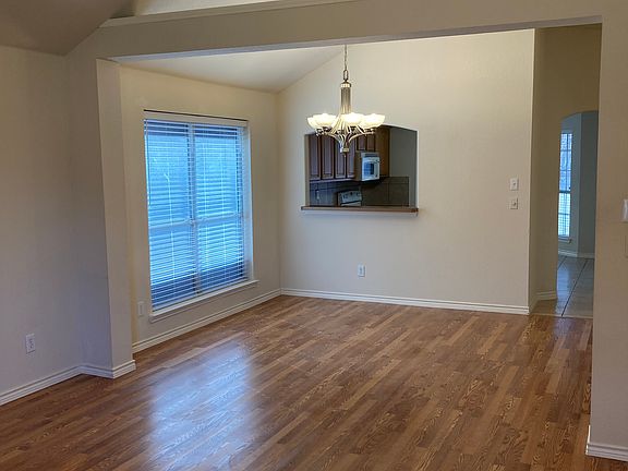 Looking back towards the kitchen from the door to the backyard.