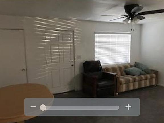 View from kitchen toward front door and living room area.