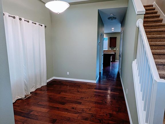 Entry with vaulted ceilings and loft above