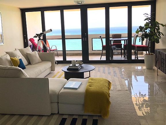 Living Area - balcony doors slide completely open to create a relaxing ambience with an indoor outdoor living space.