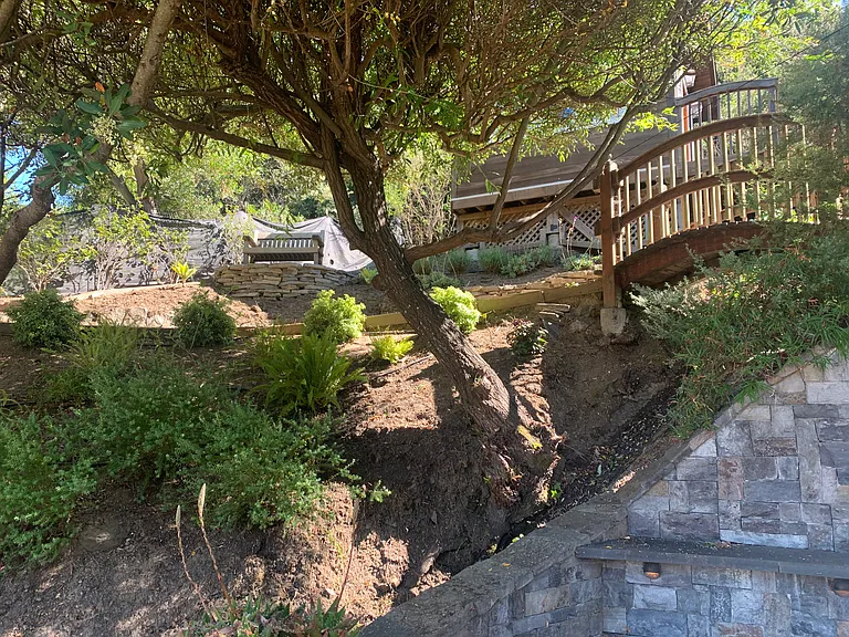 Cottage above Backyard Patio showing one of three bridges