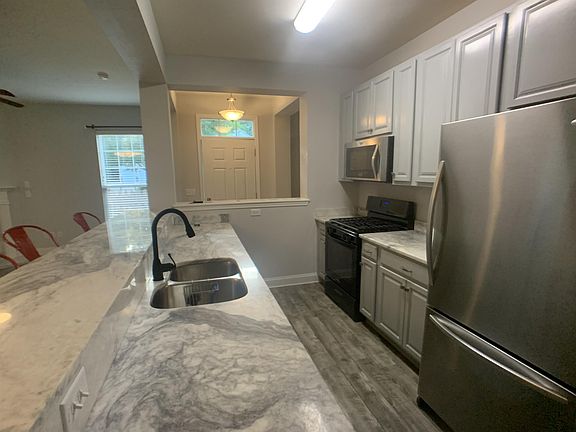 Kitchen look at entrance door
