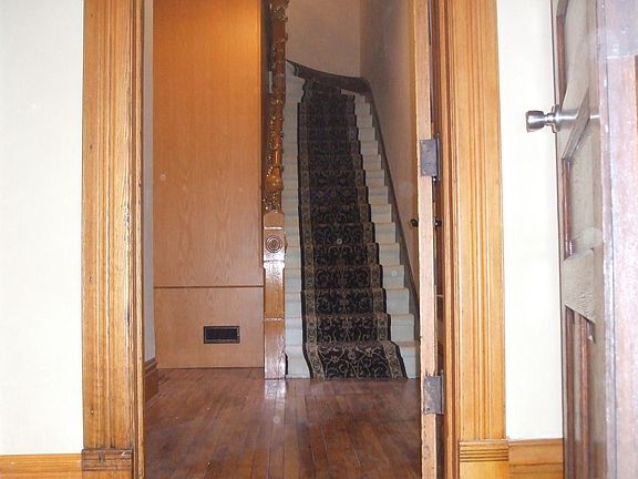 The Grand double door entrance. All wood work is original and recently refinished.