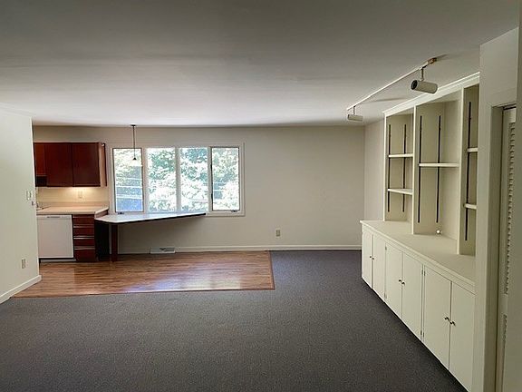 Living room showing built-ins and eat-in counter