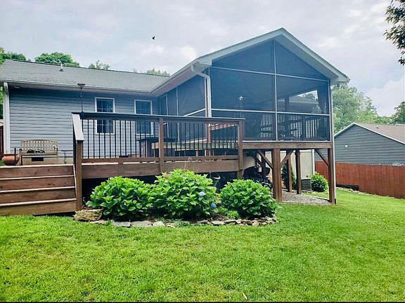 A screened-in porch and lower deck