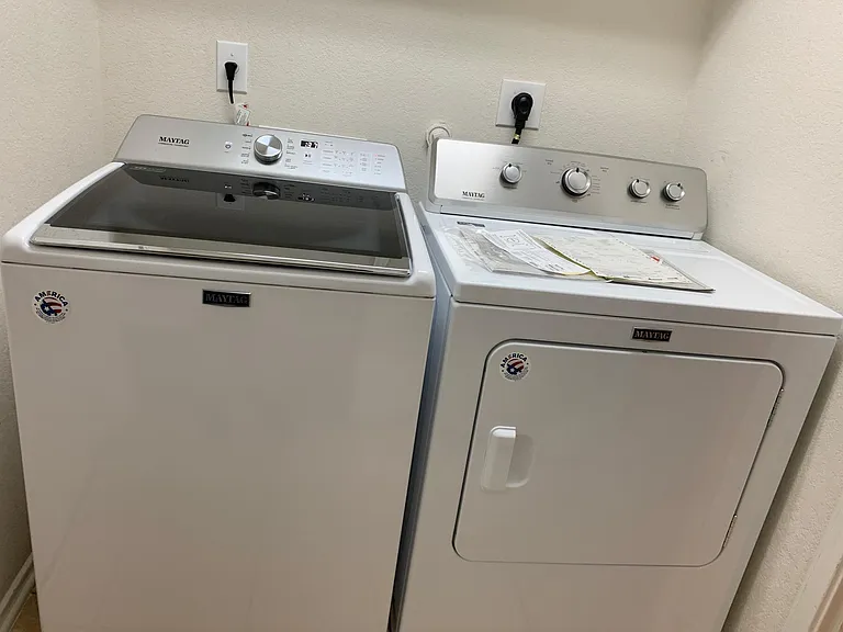 Laundry room/pantry. Newer washer/dryer
