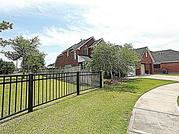 THIS WONDERFUL HOME SITS ON AN IDEAL CUL-DE-SAC LOT