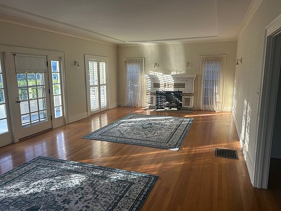 living room w/gas fireplace, energy efficient shutters