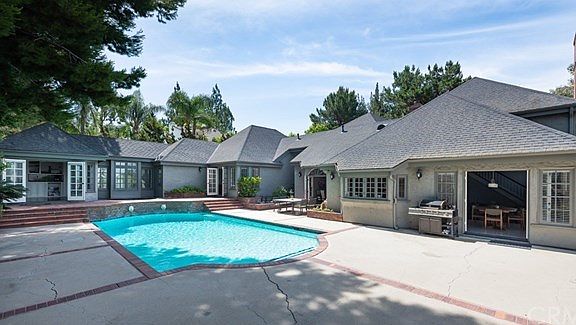 4 French Doors open to this outdoor oasis