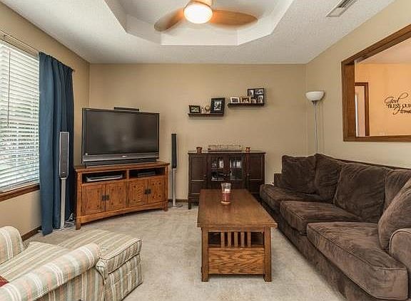 The large window provides lots of natural light.   All blinds stay, sellers are taking curtains and rods to their next home.