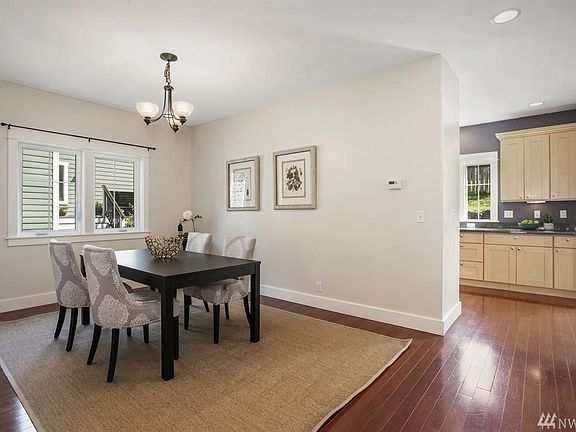 Private dinning room with the kitchen behind.