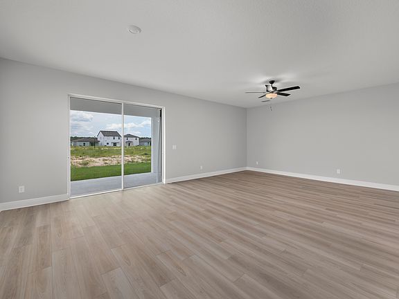 This family room opens to covered backyard patio.