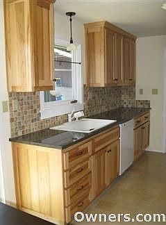 hickory cabinets, granite, travertine, Bosch dishwasher