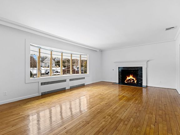 Sunny living room with bay window.