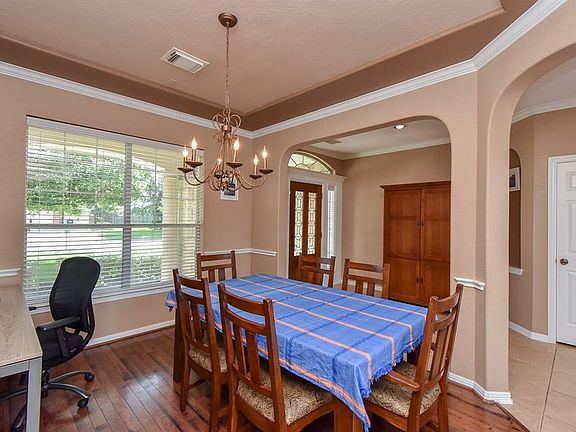 Stylish arches to the Dining Room open up this floor plan