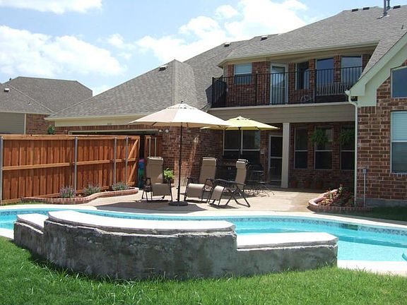 Back View with Pool and Stone Decks