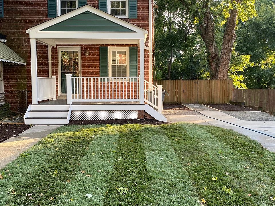 Front of home, with front yard and private driveway, street view