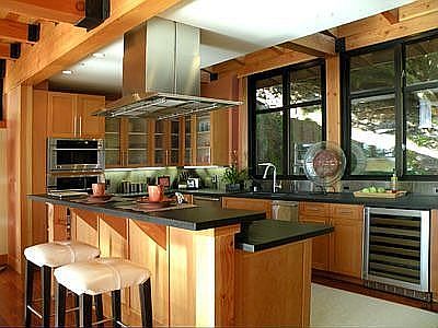 High end kitchen with views of the terraced hillside behind