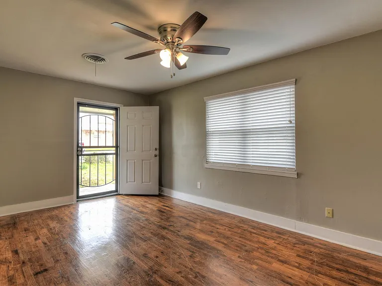 Large living room with ceiling fan