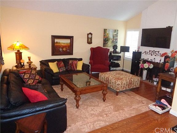 Living Room w/ Vaulted Ceilings and Fireplace