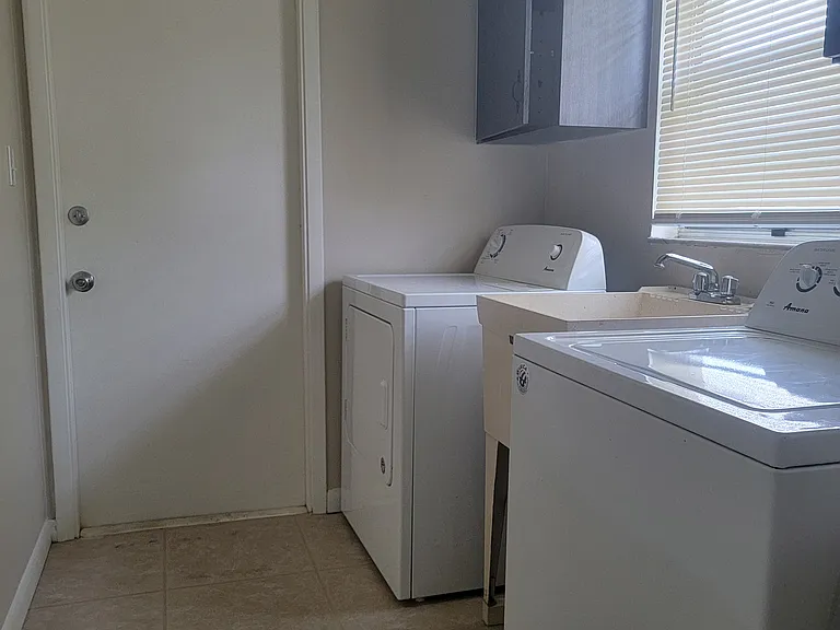 Full-Sized Washer, Dryer and Utility Sink in the Laundry Room