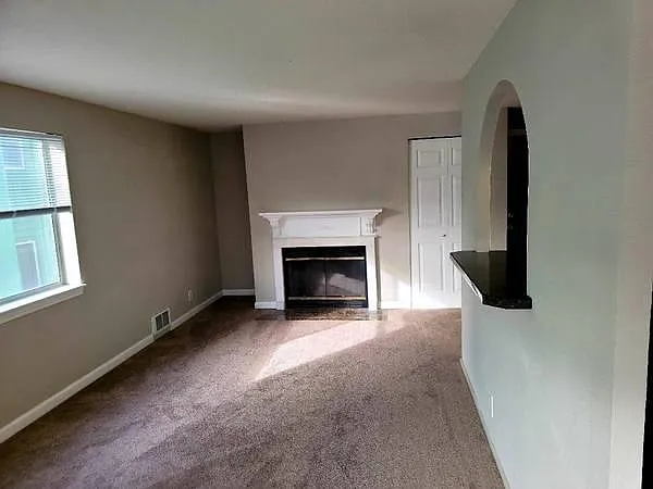 Living Room View looking towards Fireplace with Marble Mantel.