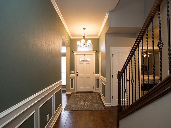 Lovely entry and gorgeous hardwoods and architectural detail.