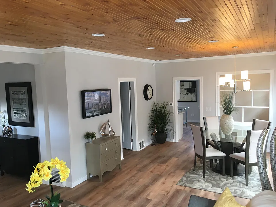 View from Living room - Kitchen, nook in the back-right, dining room.
