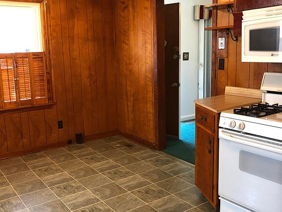 Spacious kitchen with nice flooring. Gas stove, new microwave oven.
