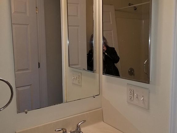 Bath with tub and shower.