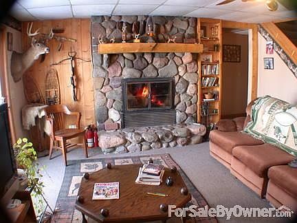 Man cave with natural stone fireplace
						:
						High output unit can heat the whole house..