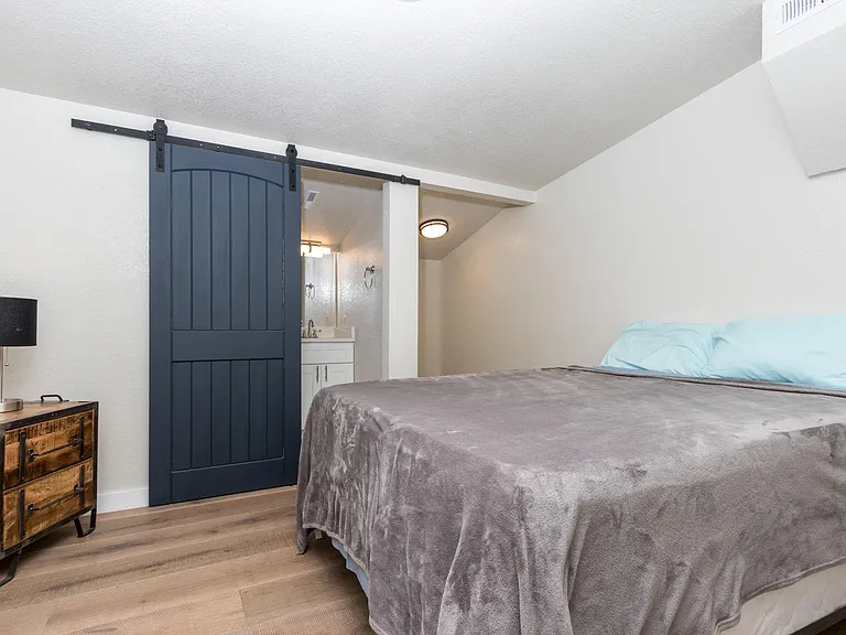 One of two bedrooms - both queen beds.