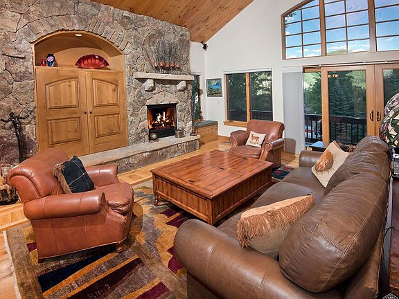 Living room with vaulted ceilings and ample natural light.