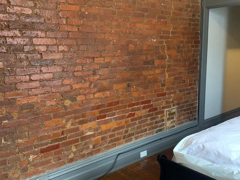 exposed brick in the bedroom