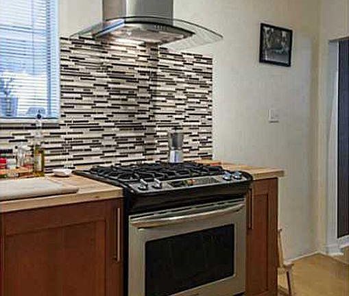 Professional stove with modern extractor. Plenty of cabinet space for all your cooking supplies
