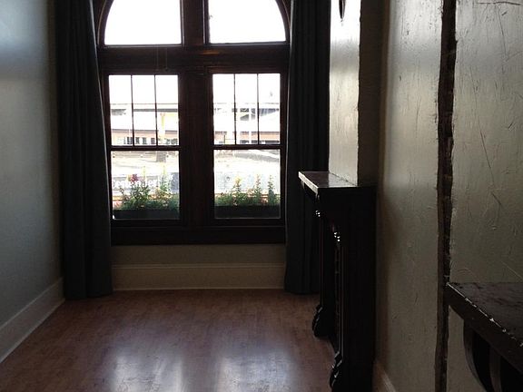 Bedroom 1 -- With giant floor-to-ceiling windows & drapes ov