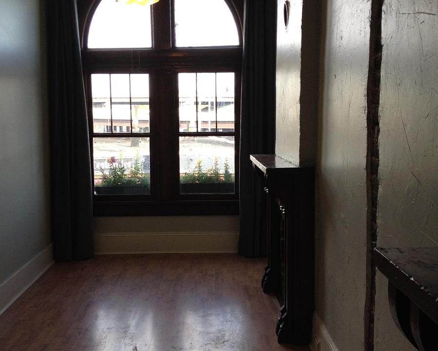 Bedroom 1 -- With giant floor-to-ceiling windows & drapes ov