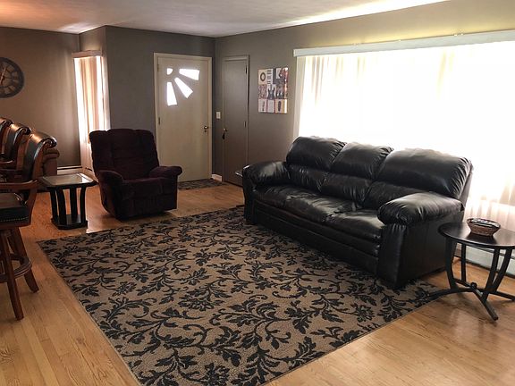 Living room with large window to beautiful hillside view