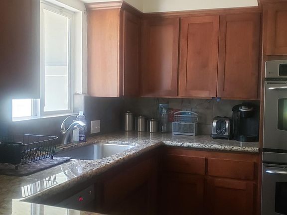 Kitchen New Stainless Steel appliances Washer & Dryer Hookups inside