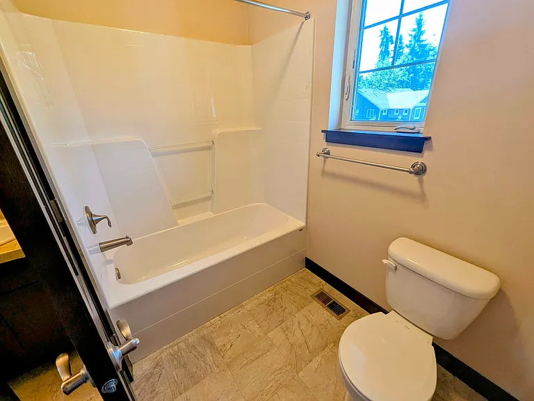 Toilet and Bath inside the Jack-n-Jill bathroom