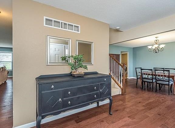Another view of the Entry. The Living Room/Office and hallway to the Family Room is to the left. The Dinning Room and walkway to the Kitchen and Laundry Room is to the right.