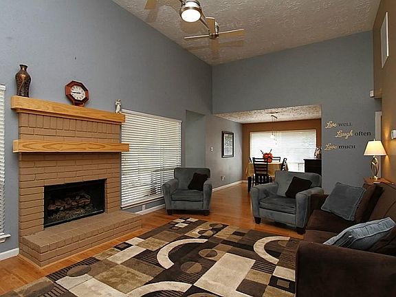 High Ceilings, Custom Lighting/Fan, Big Fireplace!