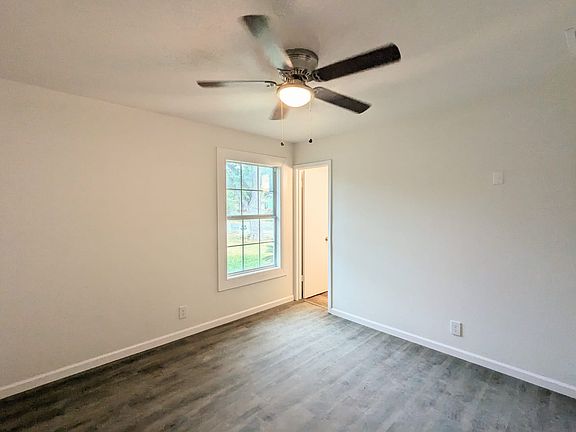 Primary bedroom with half bathroom access.