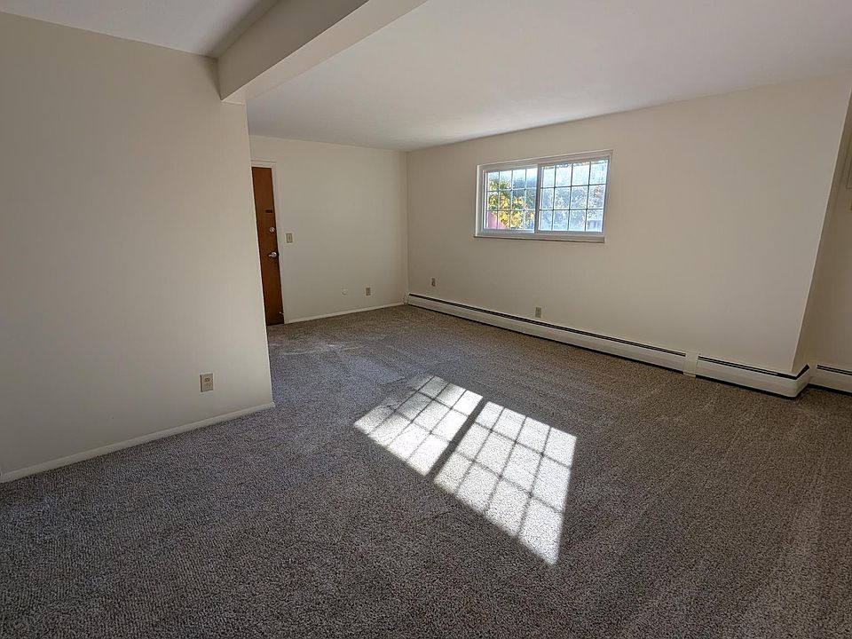 Open concept living and dining with fresh paint and new flooring