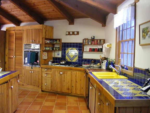 Custom counters : Cobalt and Mexican tiled backsplash & counters. Custom cabinets & pantry.
