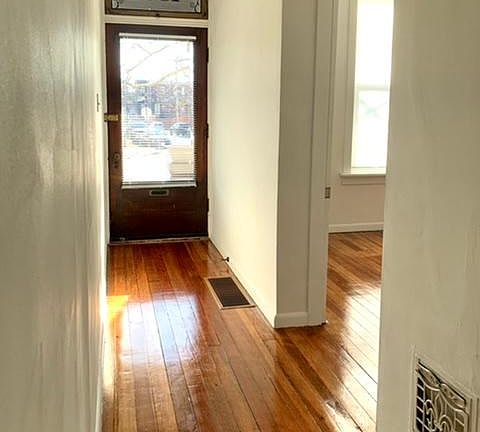 Entry hall and view of front bedroom.