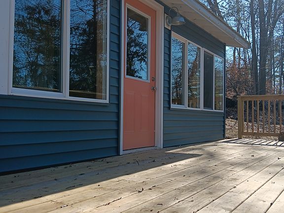 Back walkout with porch looking out to Rice Lake