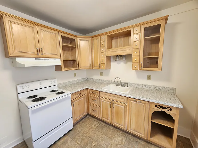 Kitchen Cabinetry and Electric Stove